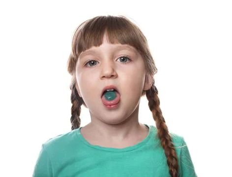Little child taking pill on white background. Danger of medicament intoxicati Stock Photos
