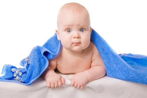 Little child under a blue towel Stock Photos