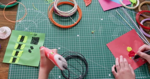 Little children draw textured patterns with 3d pens together Stock Footage 322007481