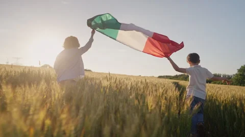 Little children joyfully run through country road waving the Mexican flag, flutt Stock Footage 337671423