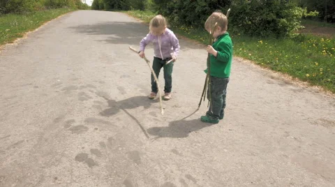 Little children plays with bug beetle on the road Stock-Footage 63474736