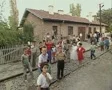 Little children standing at train station and waving at camera SD Footage