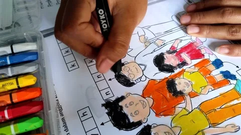 Little children's hands doing coloring assignments from school full of enthusias Stock Footage 158881741