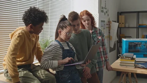 Little Classmates Discussing Code on Laptop in Primary School Stock-Footage 245456113