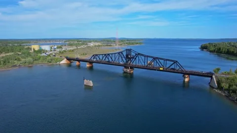 Little current swing bridge at sunny summer with blue sky. The bridge conne.. Stock-Footage 254811953