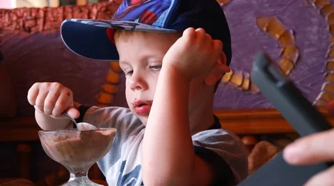 Little Cute Boy in Cap Eat Chocolate Ice Cream 스톡 동영상 59939571
