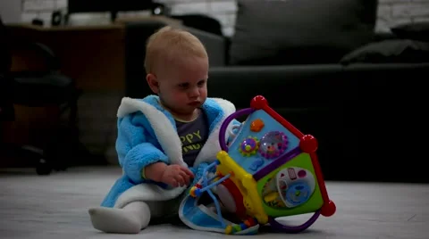 Little Cute Boy Playing at Home With Toy Video stock 61004495