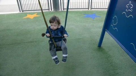 Little cute boy playing on playground. 動画素材 104012274