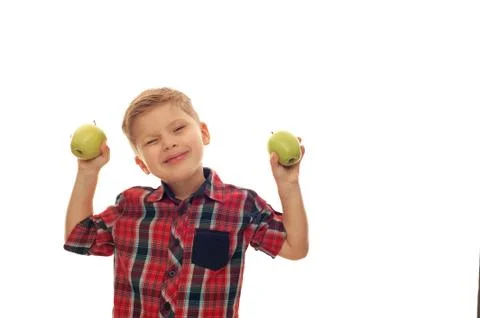 Little cute boy posing with green apples Stock Photos