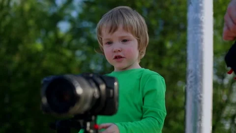 Little cute boy using video photo camera learning to use technology devices Stockbeeldmateriaal 130849403
