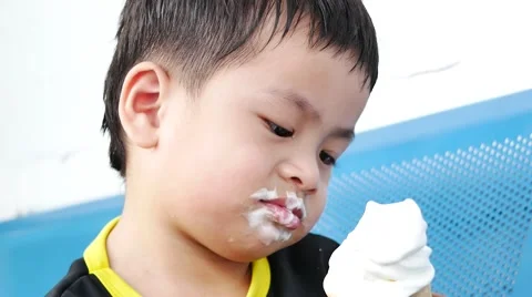 Little cute eating a vanilla ice cream in a waffle cone 스톡 동영상 59797013