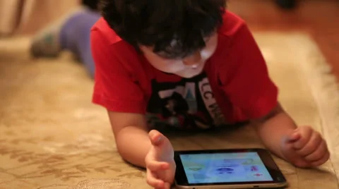 Little cute kid using digital tablet Stock Footage 37870307