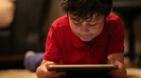 Little cute kid using digital tablet 2 Video stock 37870370