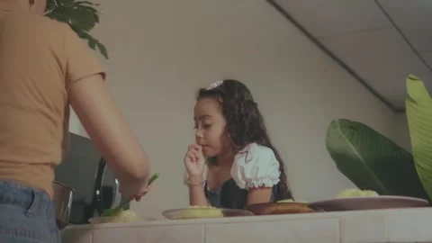 Little daughter waiting while parent preparing food Video stock 341892279