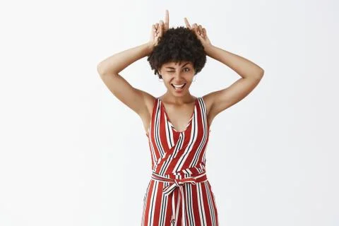 Little devil lives inside of me. Portrait of flirty and joyful good-looking Foto stock