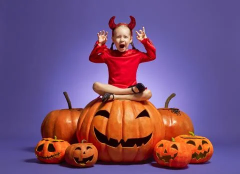 Little devil on violet background. Stock Photos