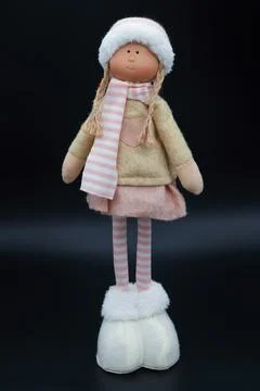 A little doll isolated on a black background Stock Photos