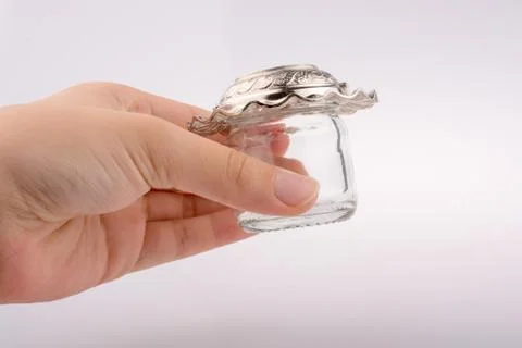 Little empty jar in hand Fotos Stock