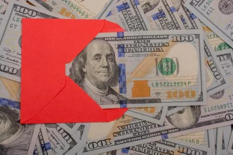 Little envelope is placed on spread US dollar Banknotes 스톡 사진