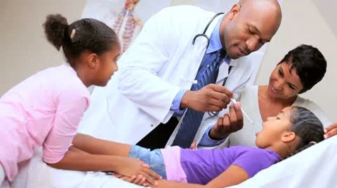 Little Ethnic Girl with Family Doctor Stock Footage
