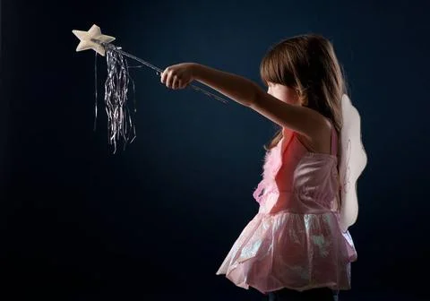 Little fairy little girl dressed up as a fairy with a magic wand ,model re... Stock Photos