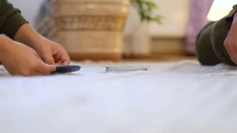 Little fun boy, is sitting on the floor with his grandmother and plays with her. Stock Footage 232921276