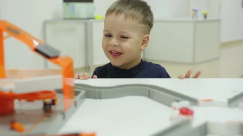 Little funny child looks at microbots in the form of cockroaches that overcome Video stock 87212075