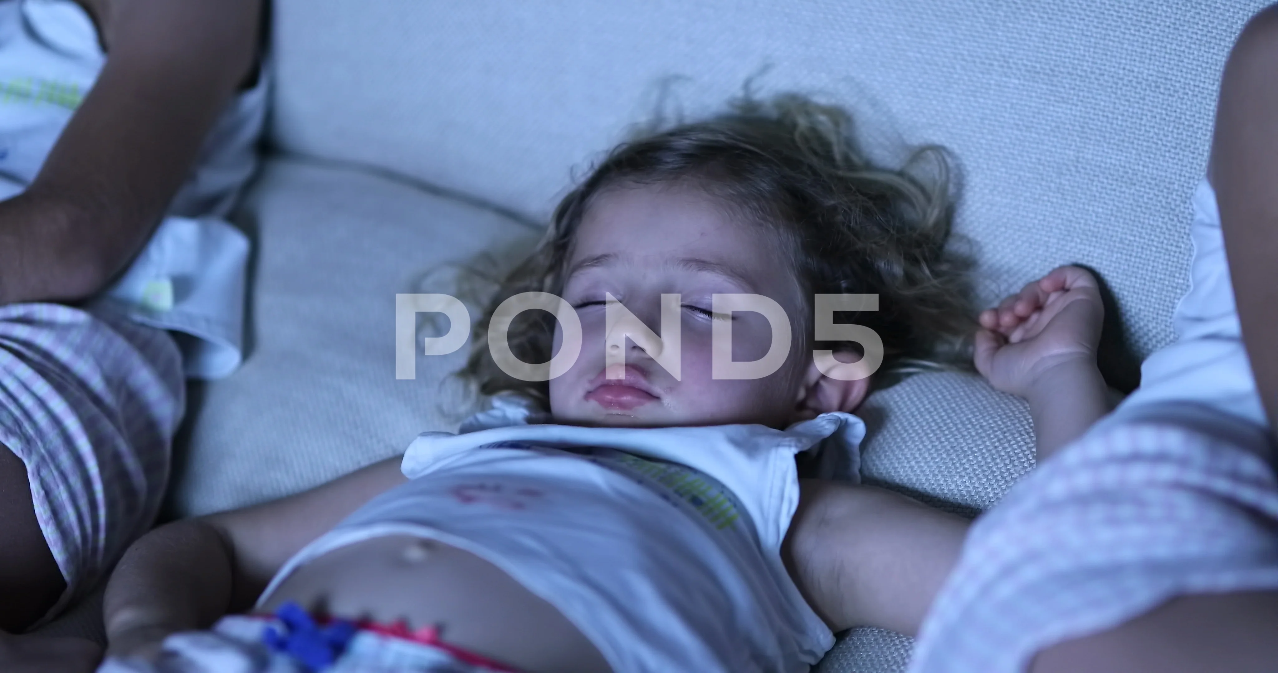 Little girl asleep in sofa in front of T, Stock Video