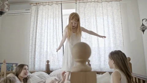 Little Girl Balancing on Hands of Father Stock Footage
