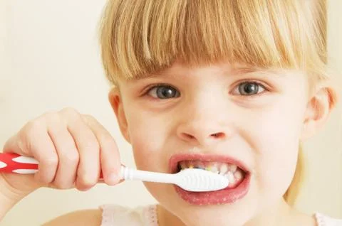 Little Girl Brushing Teeth Stock Photos