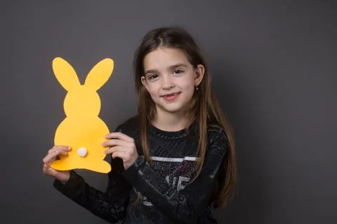 Little girl with bunnies Stock Photos