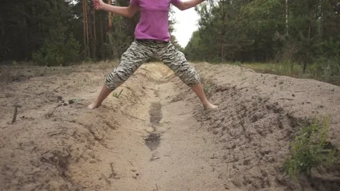 Little girl in camouflage pants with bar. Stock Video Pond5