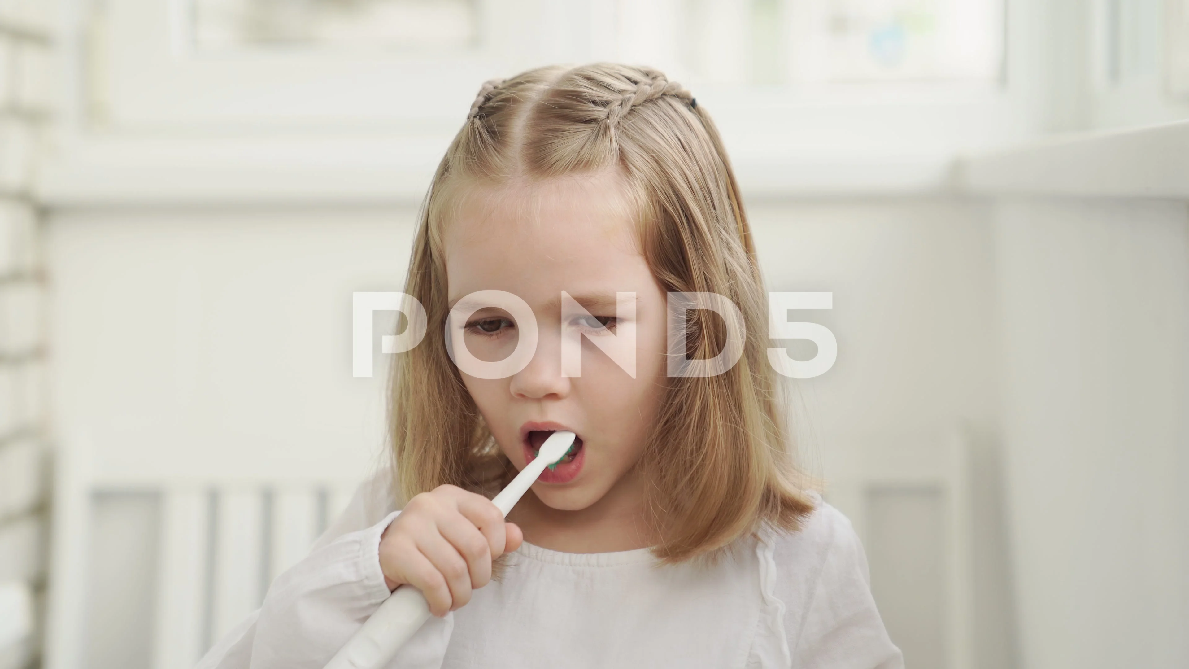 Young Girl With Electric Toothbrush
