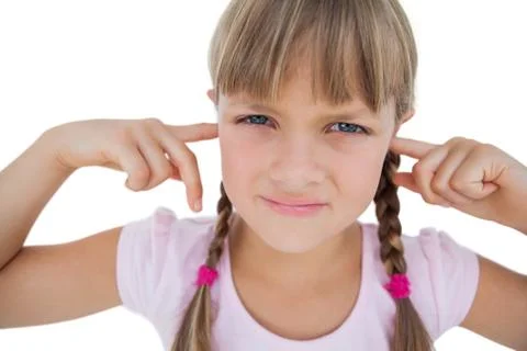 Little girl clogging her ears Stock Photos
