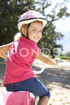 Little girl on country bike ride Stock Photos