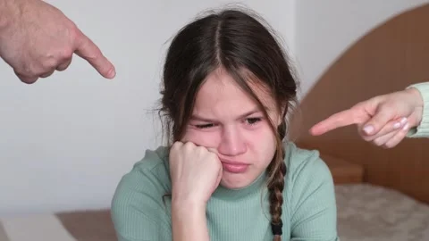 Little girl crying with resentment while parents scolding her at home Stock Footage 301693682