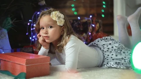 Little girl decorates the Christmas tree Stock Footage 83196341