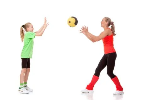 Little girl doing exercise with an instructor Stock Photos