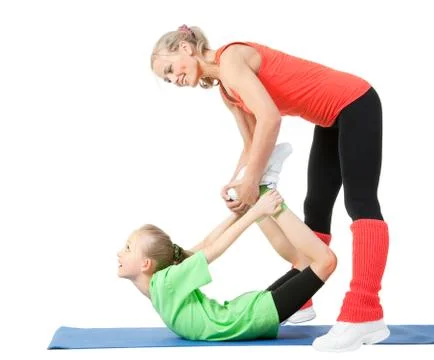 Little girl doing exercise with an instructor Stock Photos