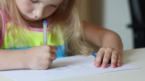 Little girl drawing sitting at the table. Stock Footage 252855152
