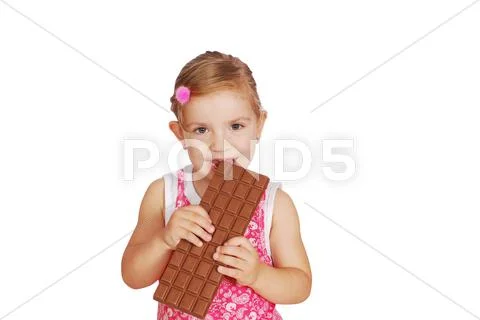 Little girl eat chocolate.JPG Stock Photos