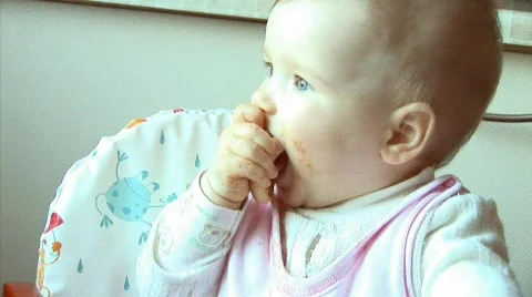 Little girl eats bread Stock Footage 380189