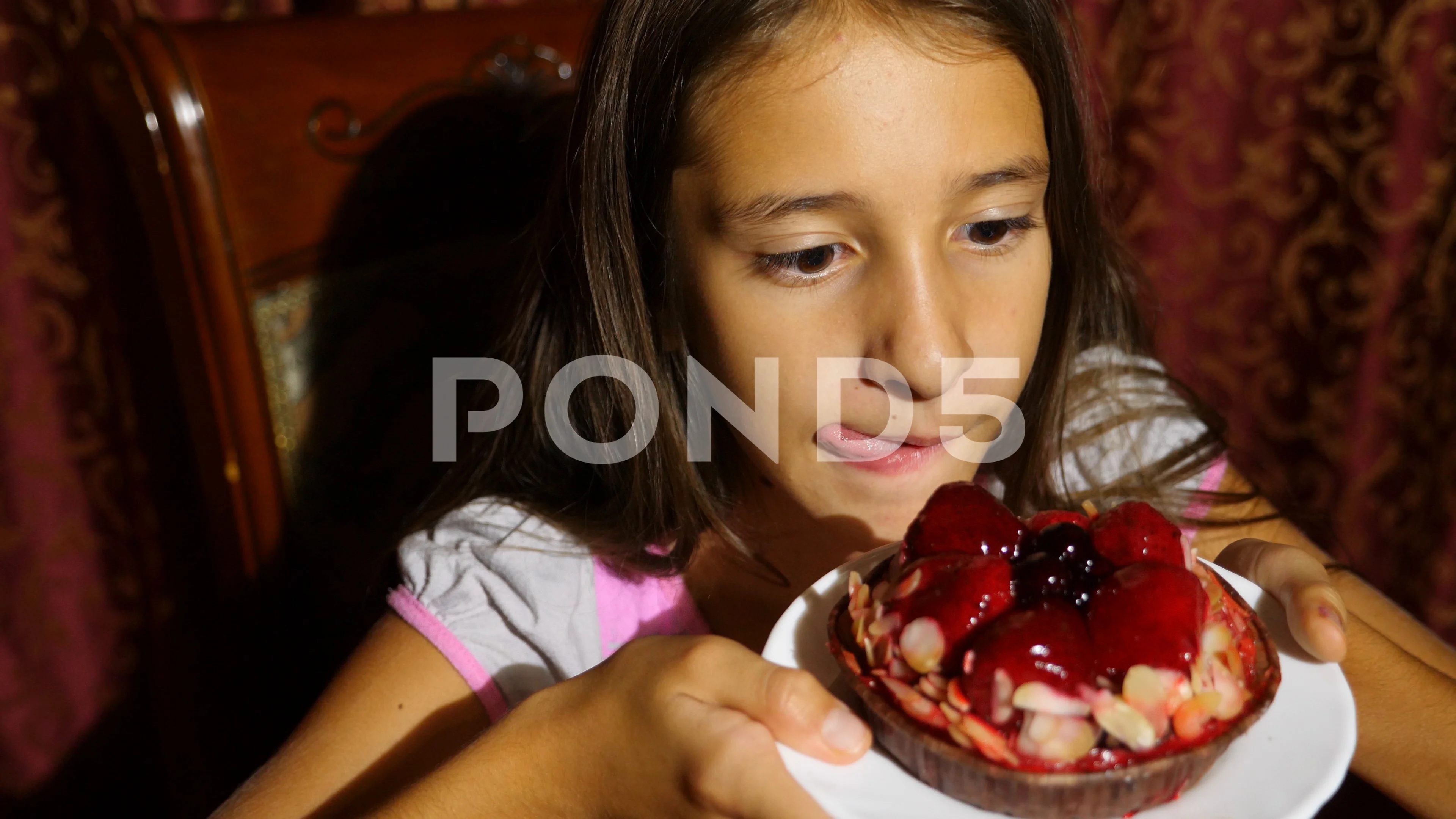 little girl eating cake