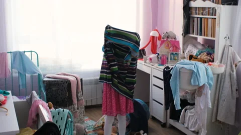Little girl has fun while trying on dress of mom Stock Footage 228879006