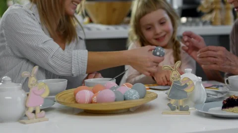 Little Girl Having Easter Dinner with Mom and Grandma Stock Footage 86741352