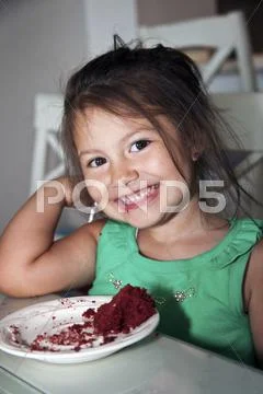 Little girl having some chocolate cake Stock Photos