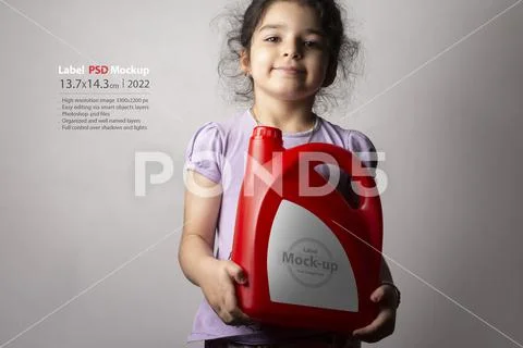 Little girl holging a red kitchen detergent bottle mock-up series PSD Template