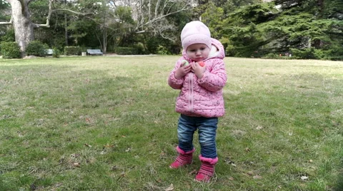 Little girl  keeps Easter eggs 動画素材 60696307