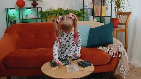 Little girl kid fixing repairing compute... | Stock Video | Pond5