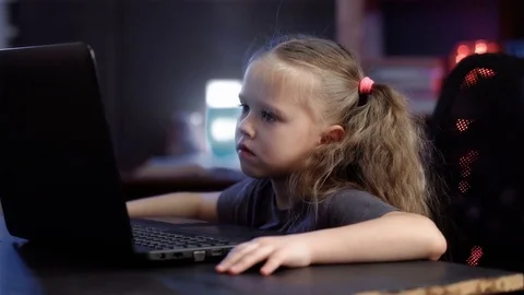 Little girl with a laptop Stock Footage 73555341